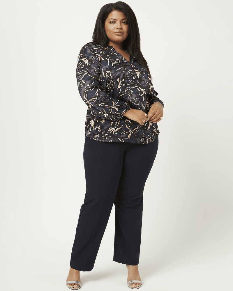 Front of a model wearing a size 1X Amari Bracelet Sleeve Pleated Blouse in Navy / Pink by T Tahari. | dia_product_style_image_id:210755
